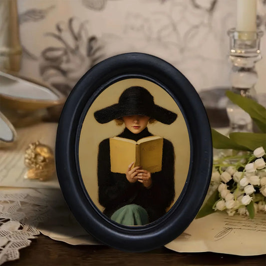 Woman Reading with a Black Hat